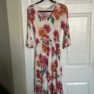 Cute midi floral dress with bell sleeves.